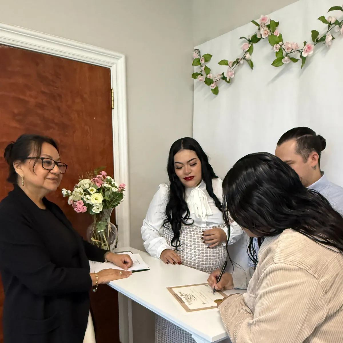 Couple signing their marriage license